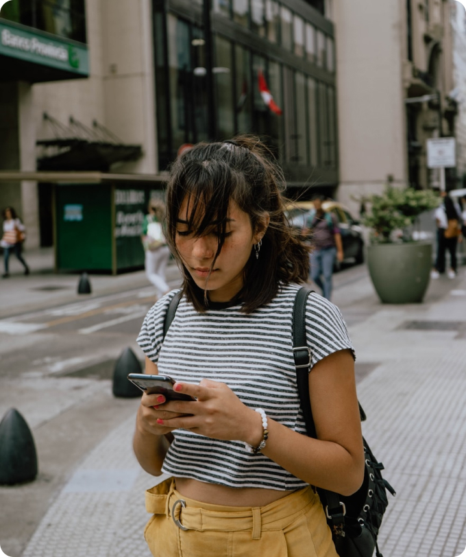 A woman reading from smartphone.