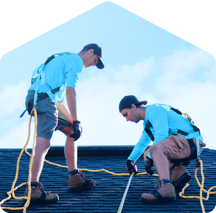 Workers repairing roof.