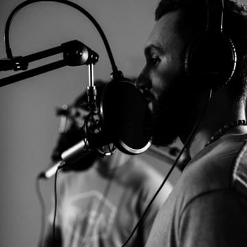 A man singing in a microphone